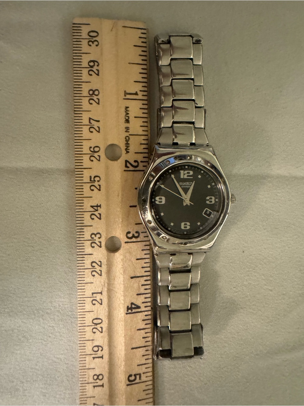 Swatch Silver Tone Watch with Black Dial